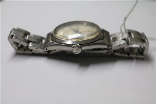 A gentlemans stainless steel Tudor Oyster manual wind wrist watch, on a stainless steel Rolex bracelet.